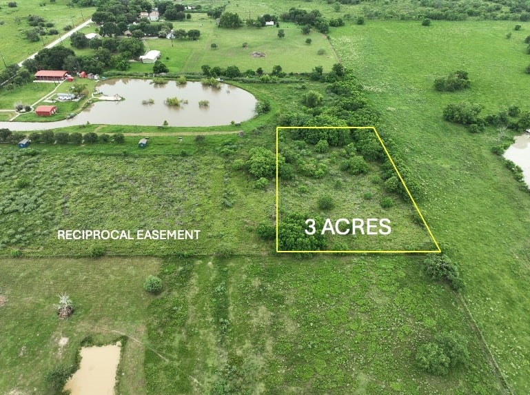 7702 Vincik Ehlert Road Rosenberg, TX 77471 - Photo 2 of 5 a view of outdoor space with a garden and signage