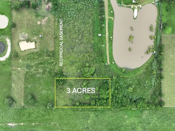 a view of a sign board with garden