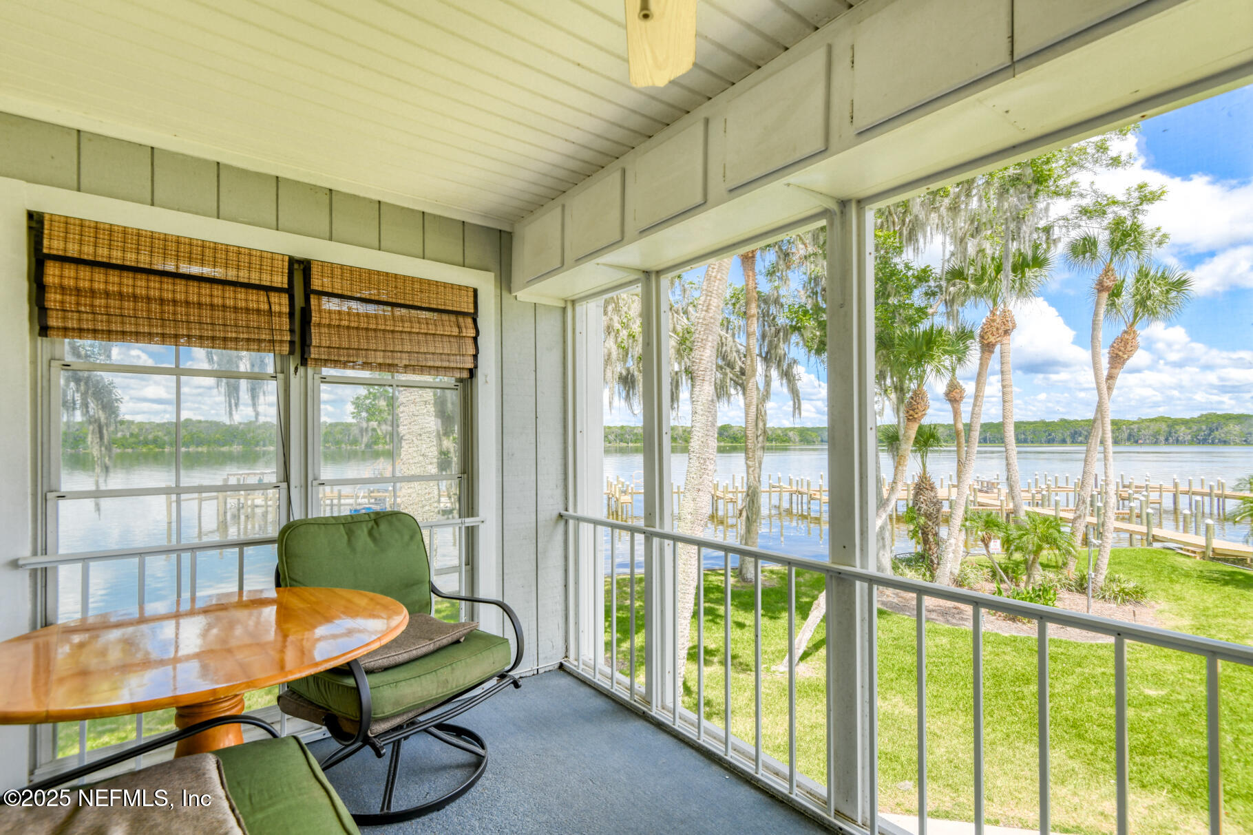 222 River Bend Court, Unit BLDG C Welaka, FL 32193 - Photo 11 of 49 a bedroom with furniture and a large window