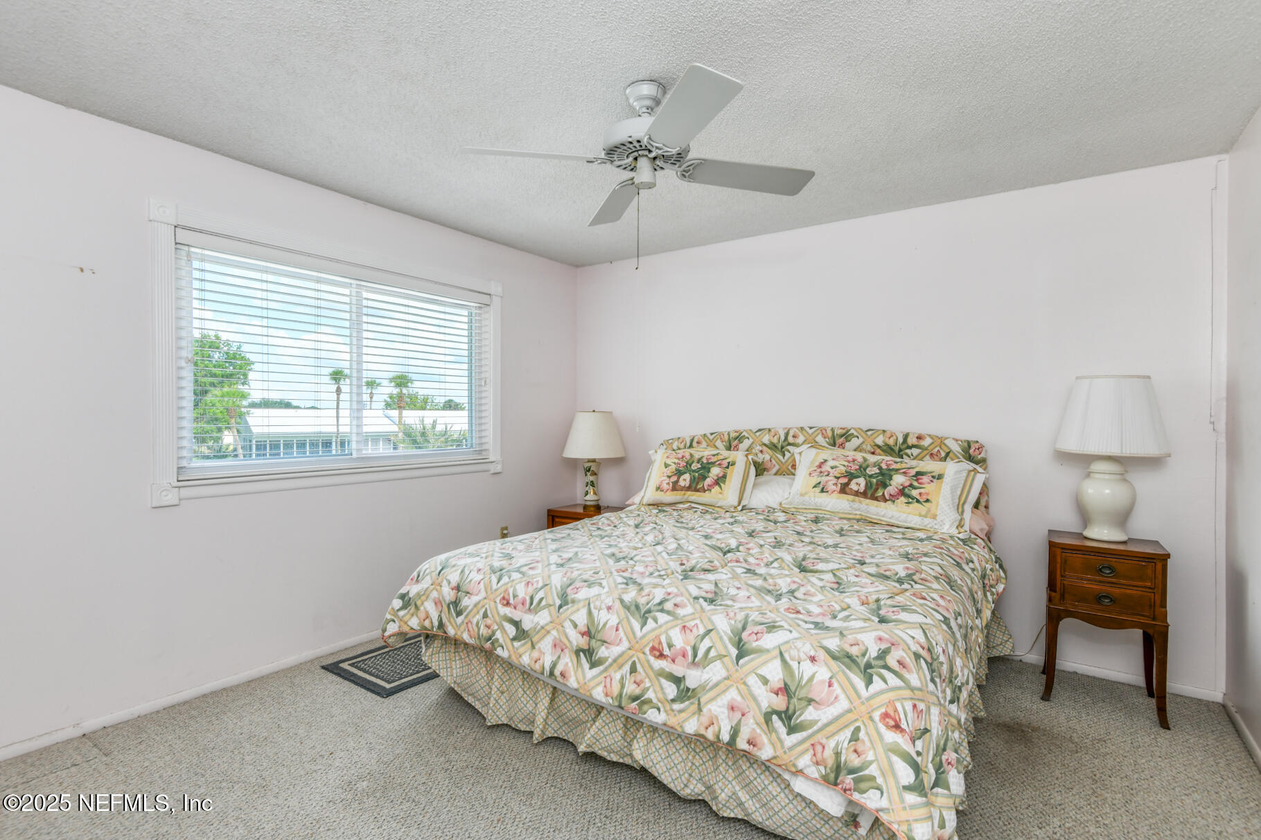 222 River Bend Court, Unit BLDG C Welaka, FL 32193 - Photo 14 of 49 a bedroom with a bed and window