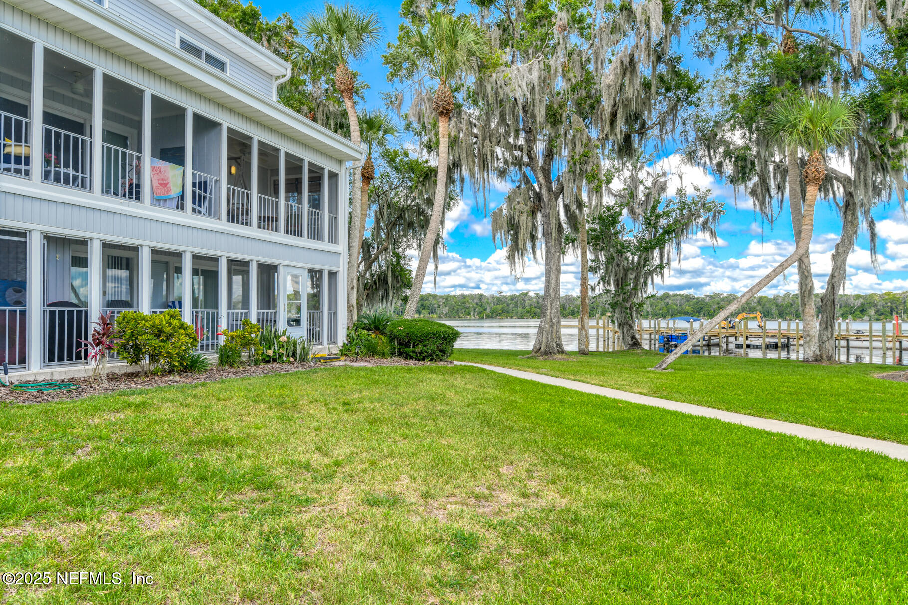 222 River Bend Court, Unit BLDG C Welaka, FL 32193 - Photo 23 of 49 a view of a house with a yard and plants
