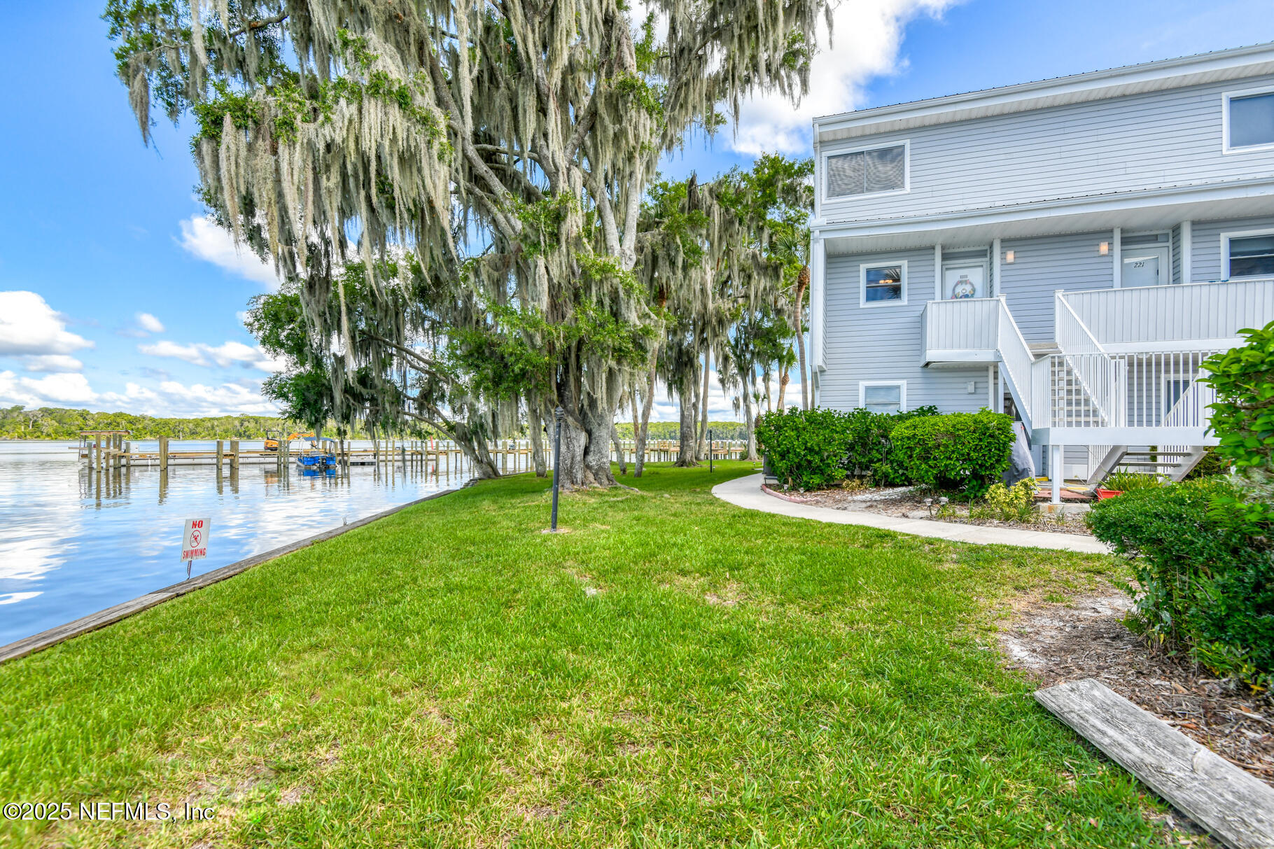222 River Bend Court, Unit BLDG C Welaka, FL 32193 - Photo 3 of 49 a view of a backyard with a garden