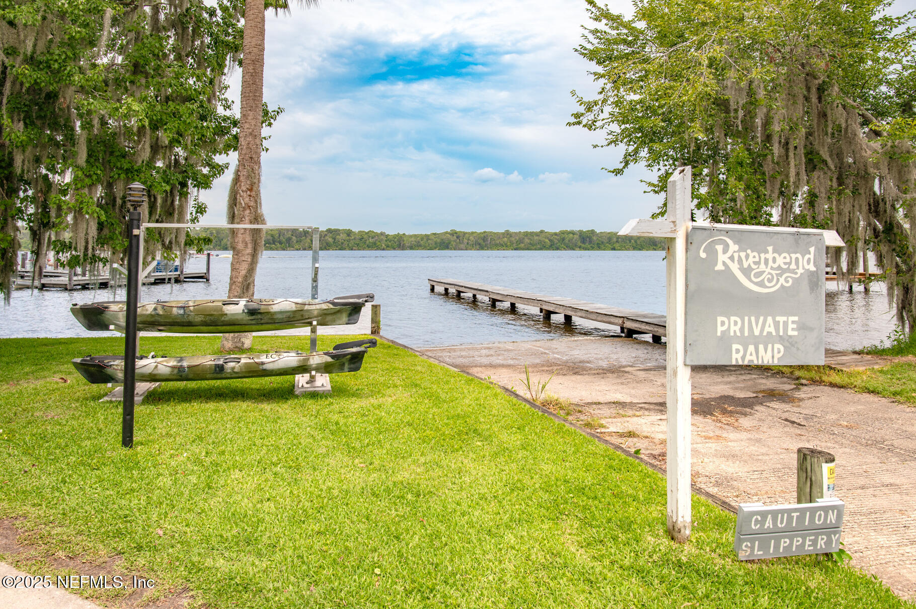 222 River Bend Court, Unit BLDG C Welaka, FL 32193 - Photo 32 of 49 a park view with a bench and bench