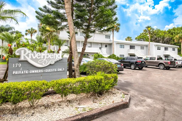 a front view of a building with garden