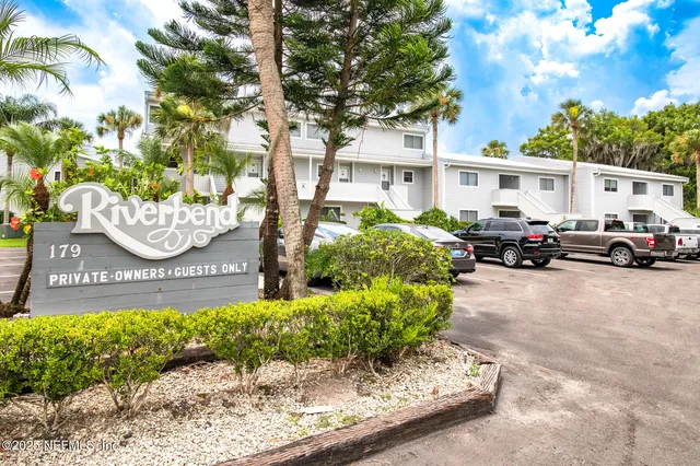 a front view of a building with garden