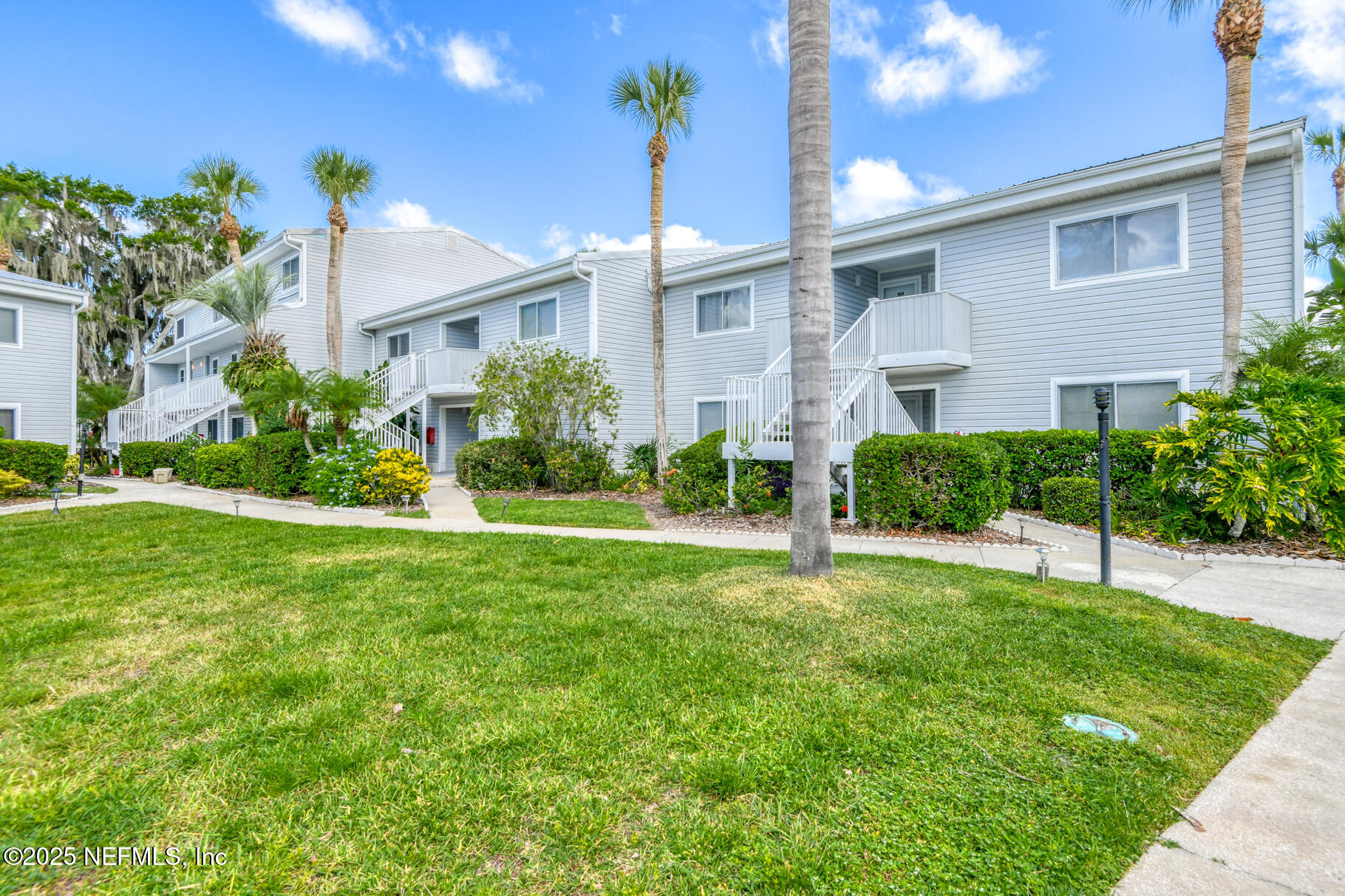 222 River Bend Court, Unit BLDG C Welaka, FL 32193 - Photo 36 of 49 a view of a house with a yard and plants