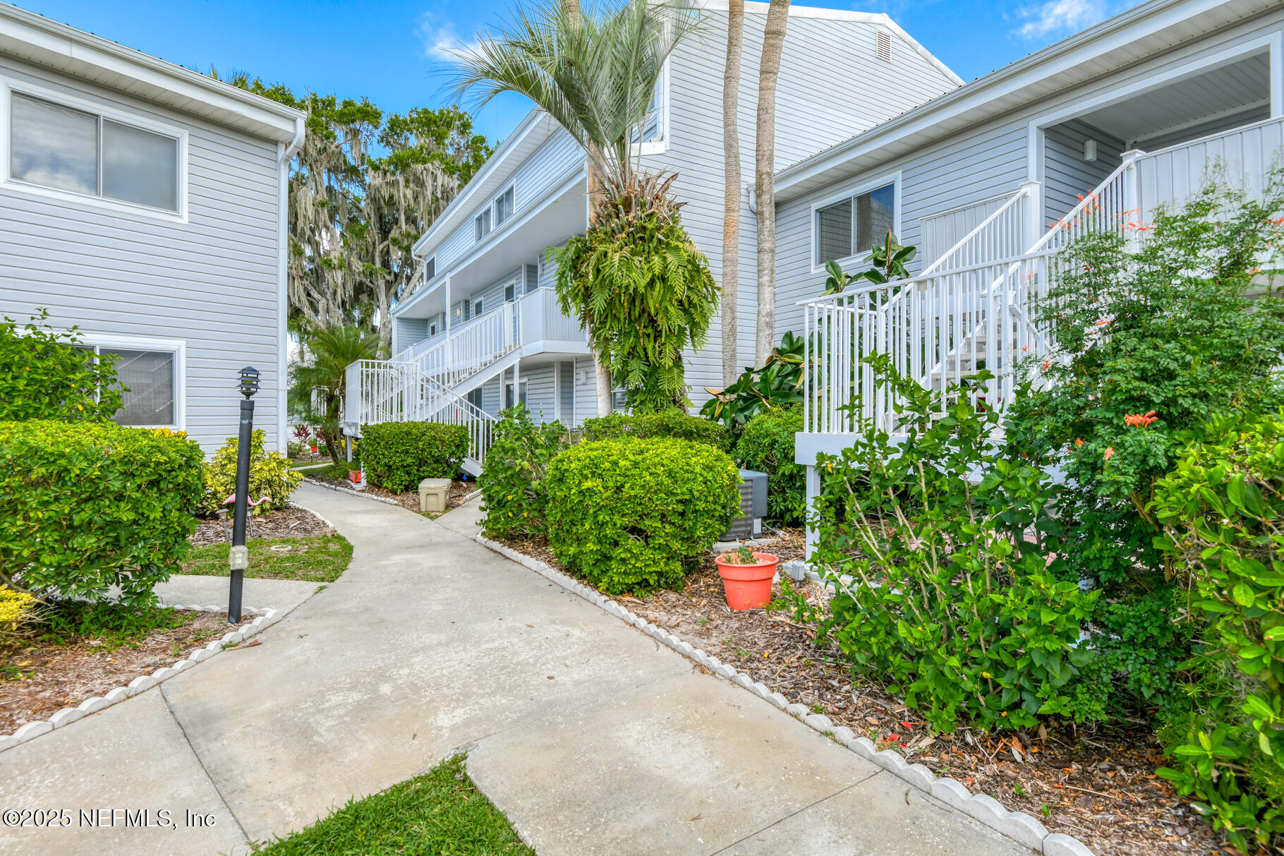 222 River Bend Court, Unit BLDG C Welaka, FL 32193 - Photo 37 of 49 a view of a house with potted plants