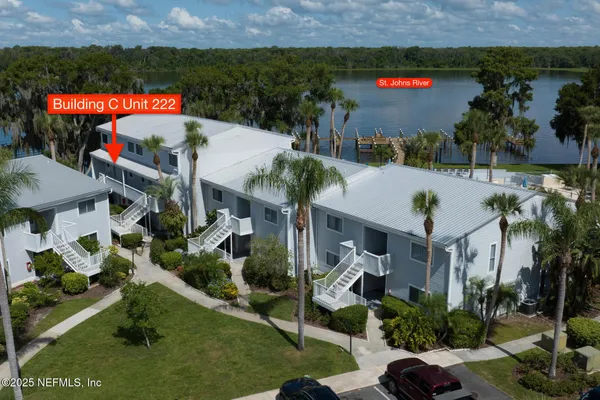 an outdoor space with seating area and car parked