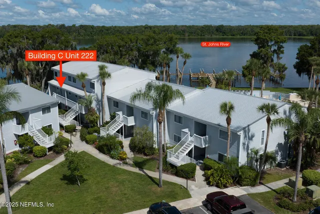 an outdoor space with seating area and car parked