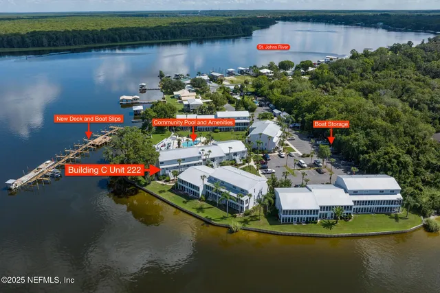 an aerial view of a house with a lake view