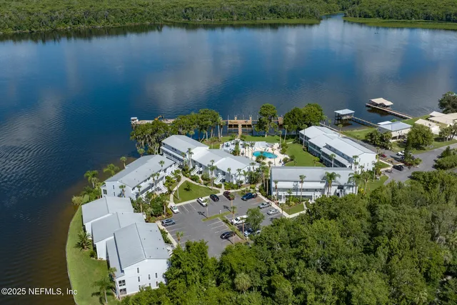 a aerial view of a house with a lake view