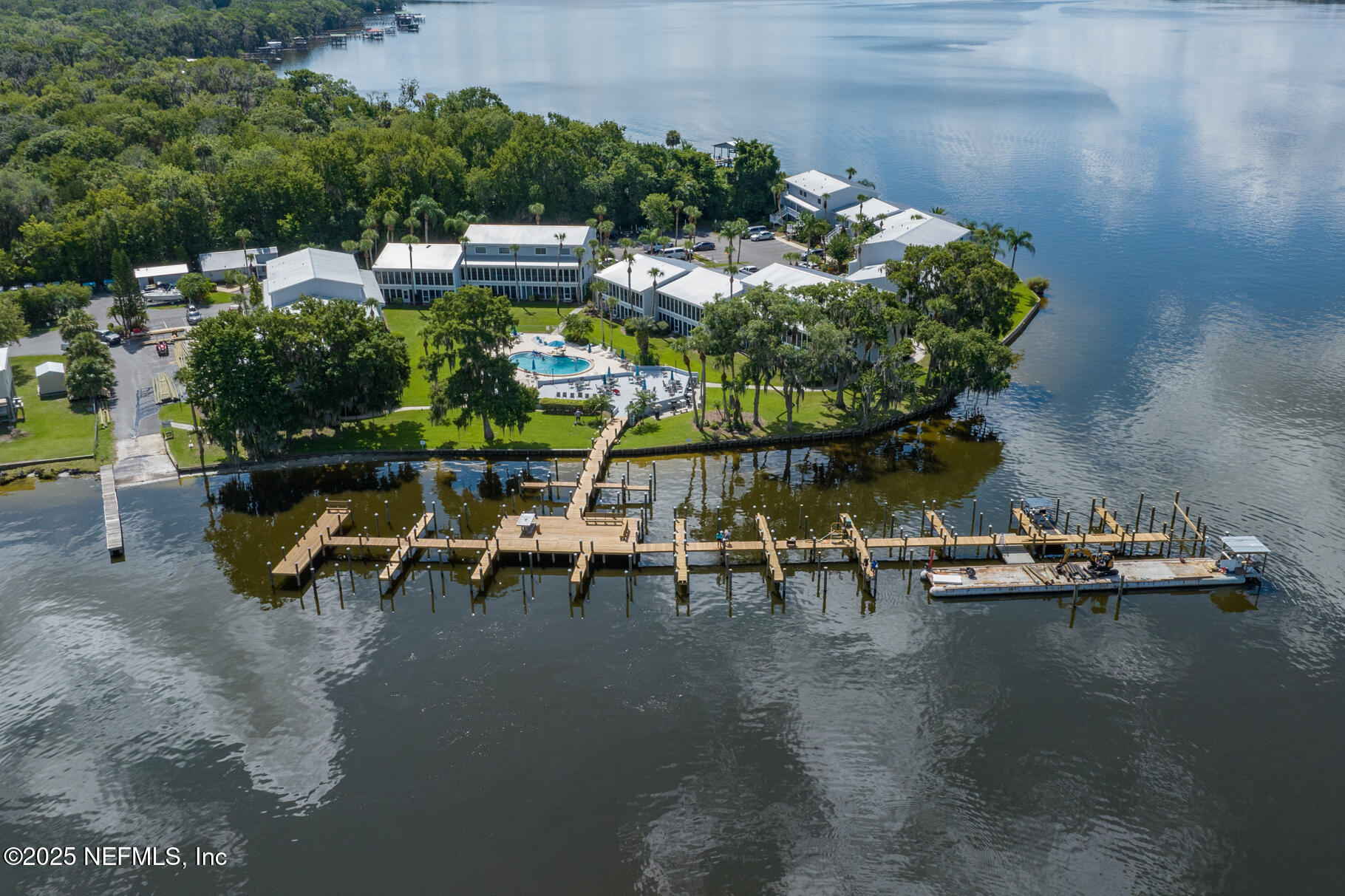 222 River Bend Court, Unit BLDG C Welaka, FL 32193 - Photo 44 of 49 a view of a lake with chairs