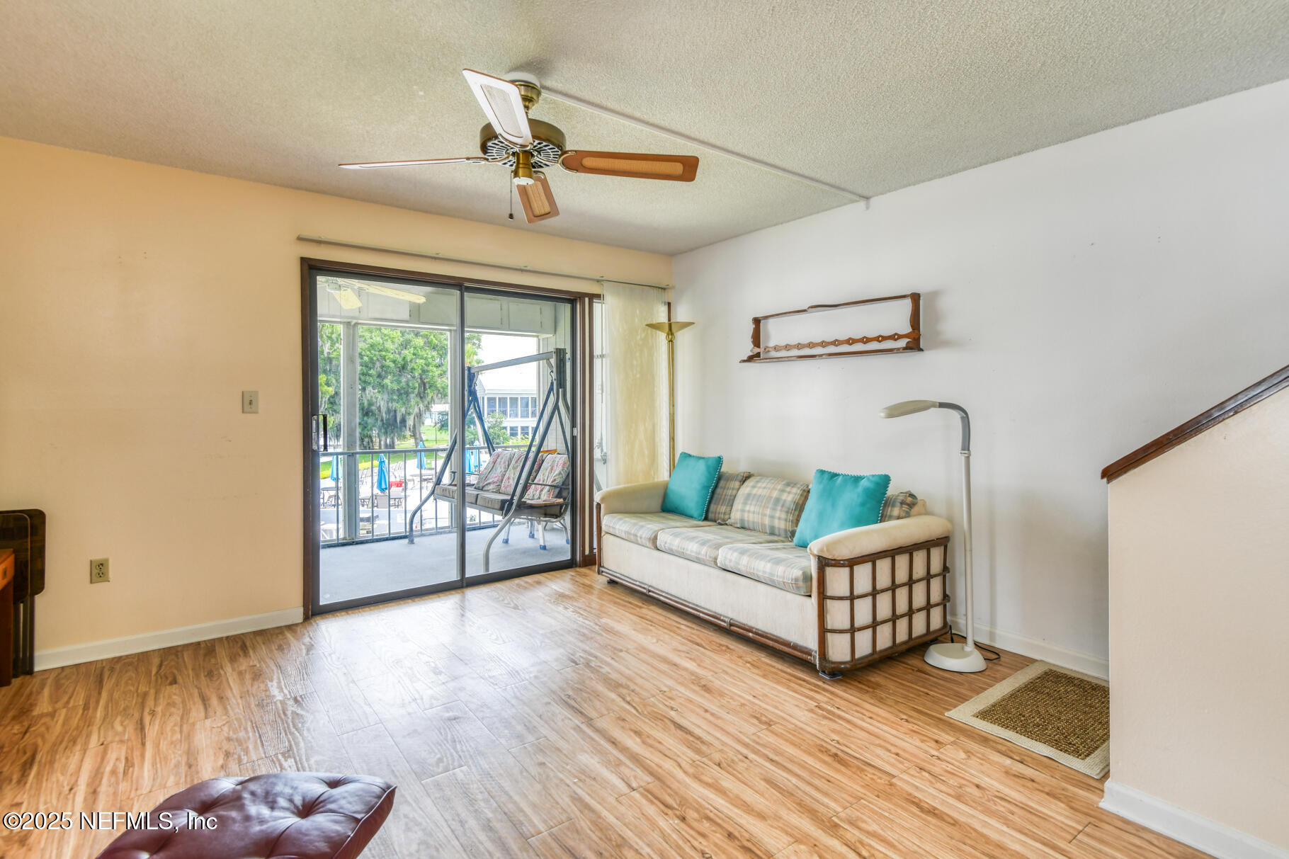 222 River Bend Court, Unit BLDG C Welaka, FL 32193 - Photo 10 of 49 a living room with furniture and wooden floor