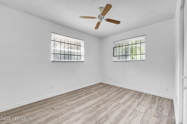 an empty room with windows