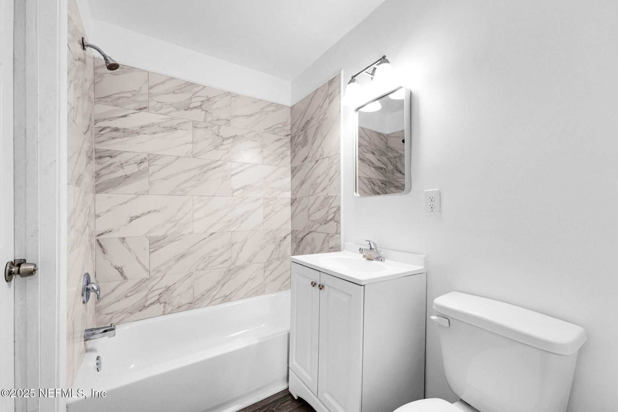 9155 Sibbald Road Jacksonville, FL 32208 - Photo 15 of 22 a bathroom with a sink toilet and shower