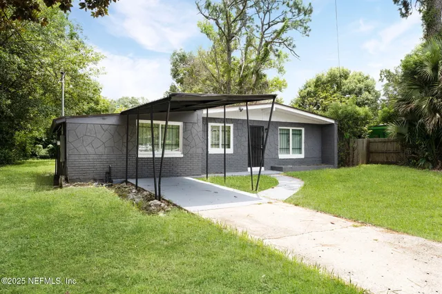 front view of a house with a yard