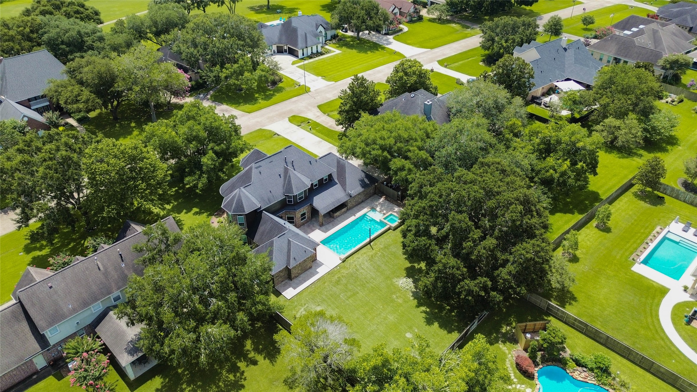 5327 Whitmore Fulshear, TX 77441 - Photo 44 of 50 Surrounded by mature trees and custom homes, this exceptional property offers the perfect blend of privacy, luxury, and community living.