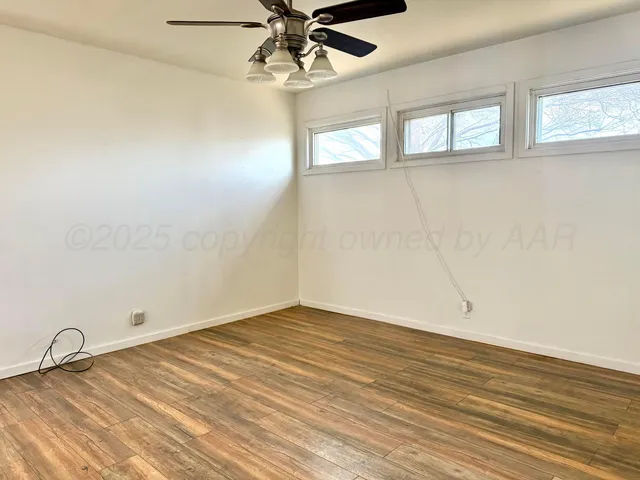 a bathroom with a sink vanity mirror and toilet
