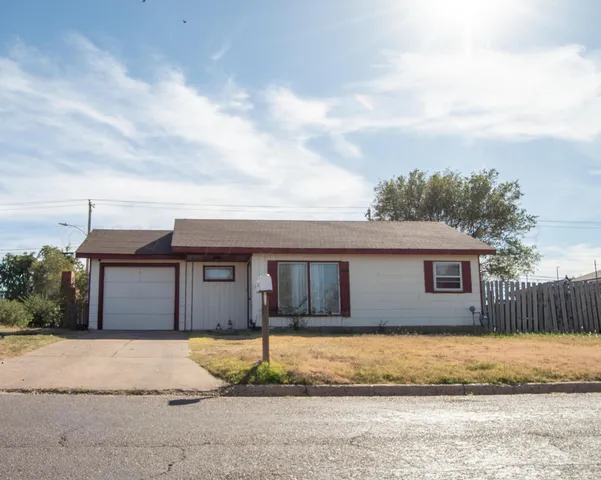 a kitchen with a sink a stove and refrigerator