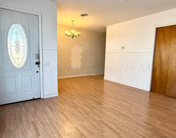a bathroom with a toilet and a shower curtain