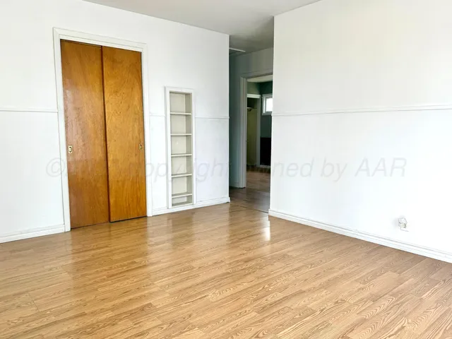 a white refrigerator freezer and a stove sitting inside of a kitchen