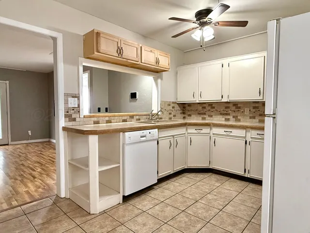 a view of an empty room with a fireplace