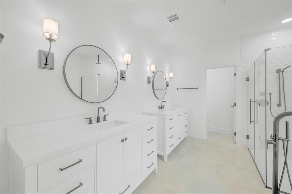 1002 Ashcroft Lane Justin, TX 76247 - Photo 16 of 29 a bathroom with a double vanity sink mirror and shower