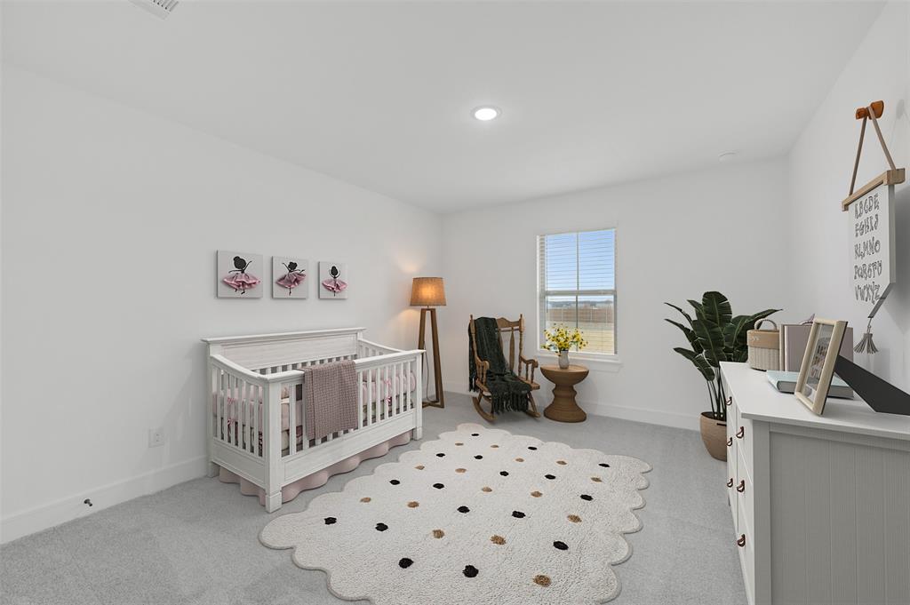 1002 Ashcroft Lane Justin, TX 76247 - Photo 25 of 29 a bedroom with furniture and a window