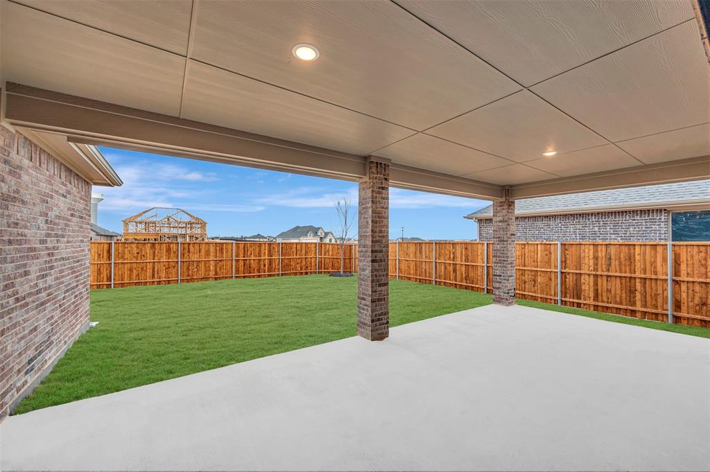 1002 Ashcroft Lane Justin, TX 76247 - Photo 27 of 29 a view of a backyard of a house