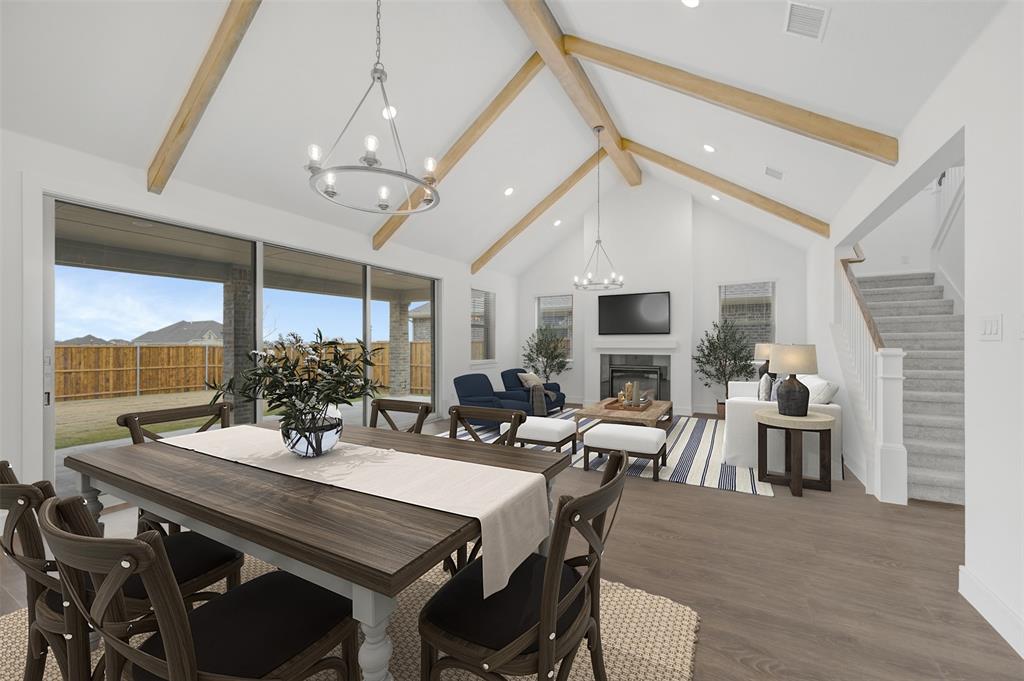 1002 Ashcroft Lane Justin, TX 76247 - Photo 5 of 29 a view of a dining room with furniture window and wooden floor