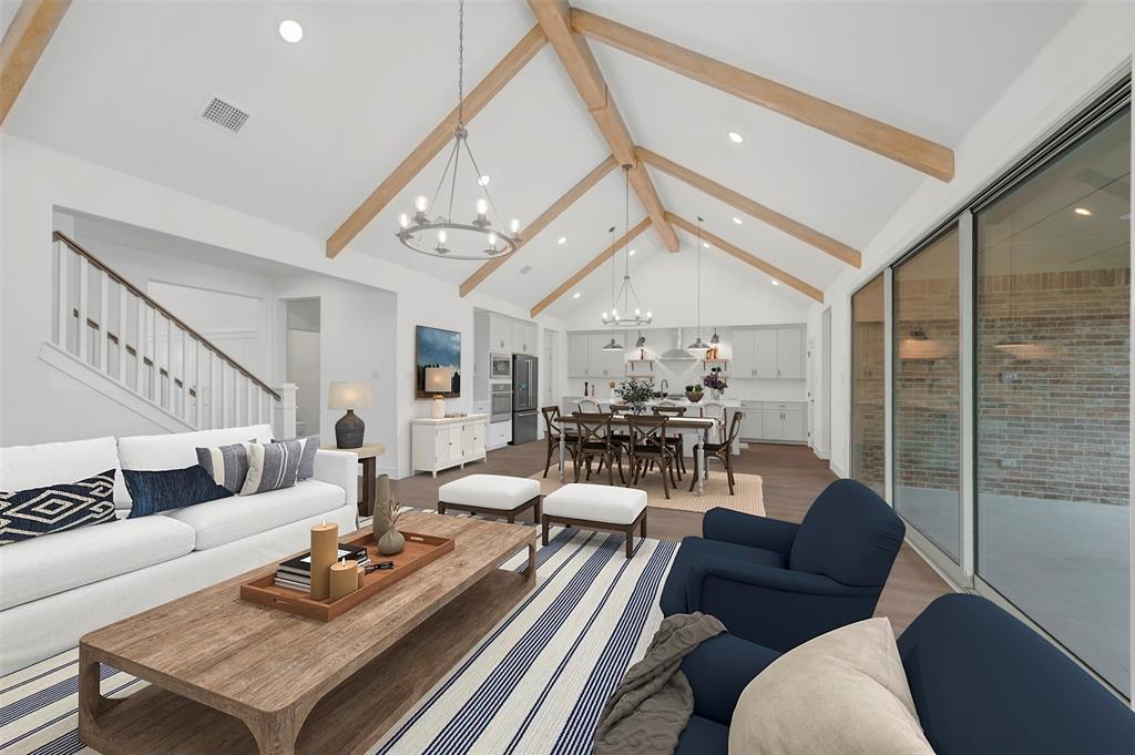 1002 Ashcroft Lane Justin, TX 76247 - Photo 7 of 29 a living room with furniture and a chandelier