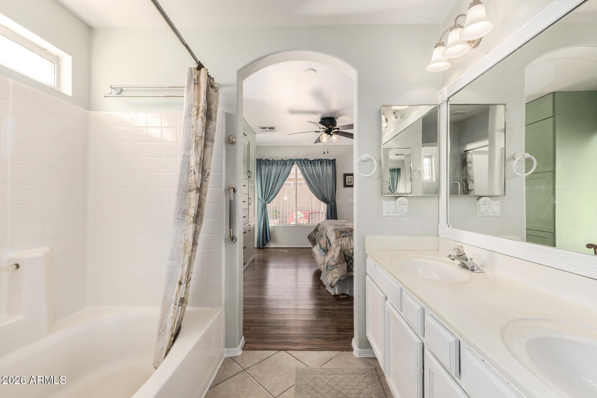 79 West Gail Drive Gilbert, AZ 85233 - Photo 23 of 37 Primary bath, arch to bedroom