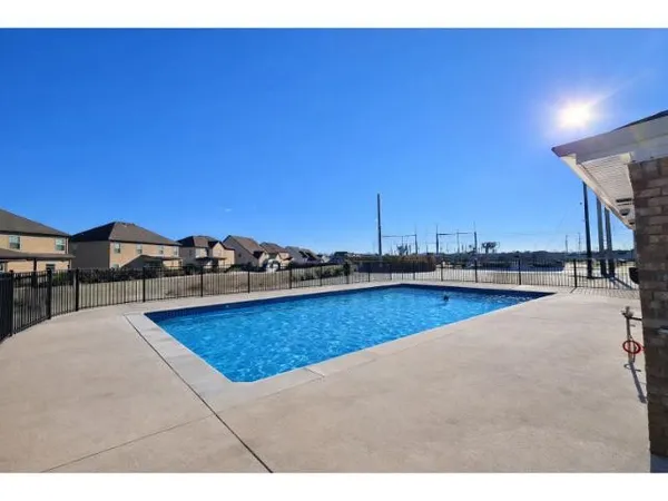 a view of a swimming pool and mountain view