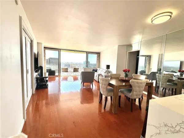 a view of a living room and dining room