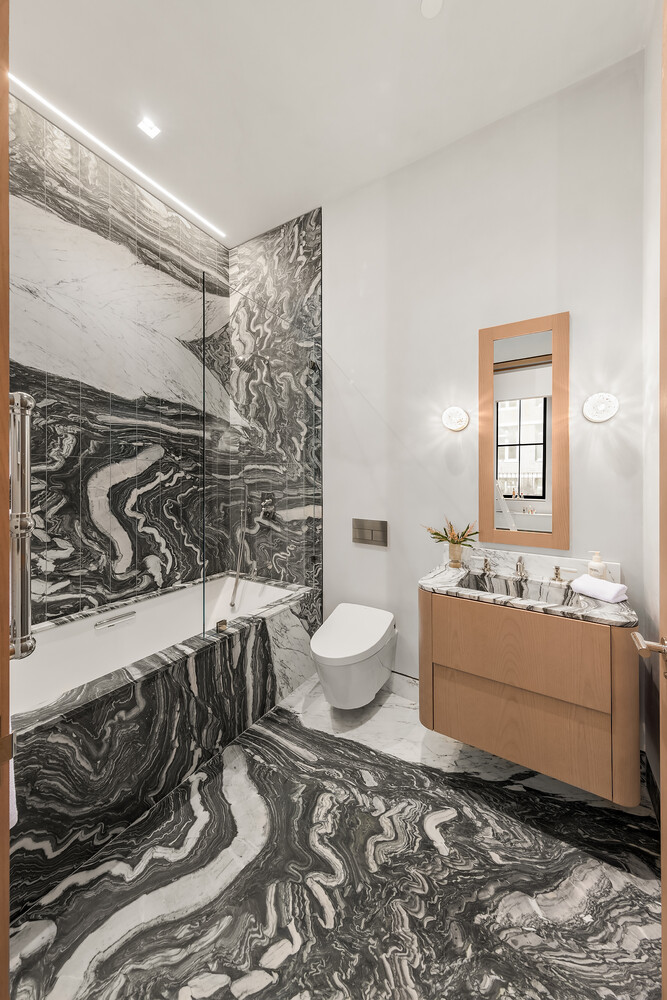 85 Worth Street, Unit 3 Manhattan, NY 10013 - Photo 7 of 14 a bathroom with a granite countertop sink and a mirror