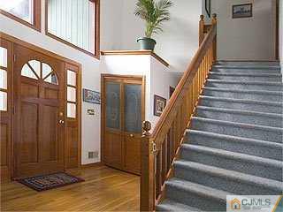 115 Hollow Road Skillman, NJ 08558 - Photo 2 of 8 a view of an entryway with staircase