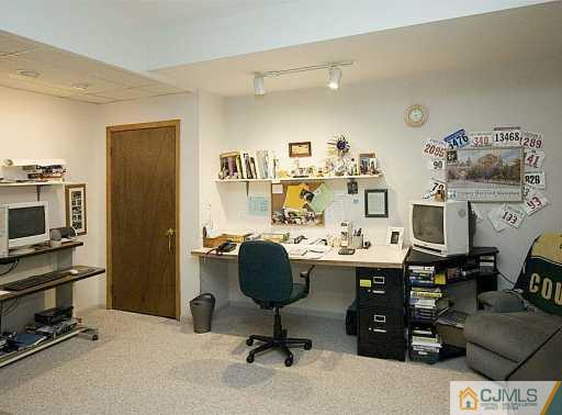 115 Hollow Road Skillman, NJ 08558 - Photo 7 of 8 a view of a workspace with furniture and cabinet