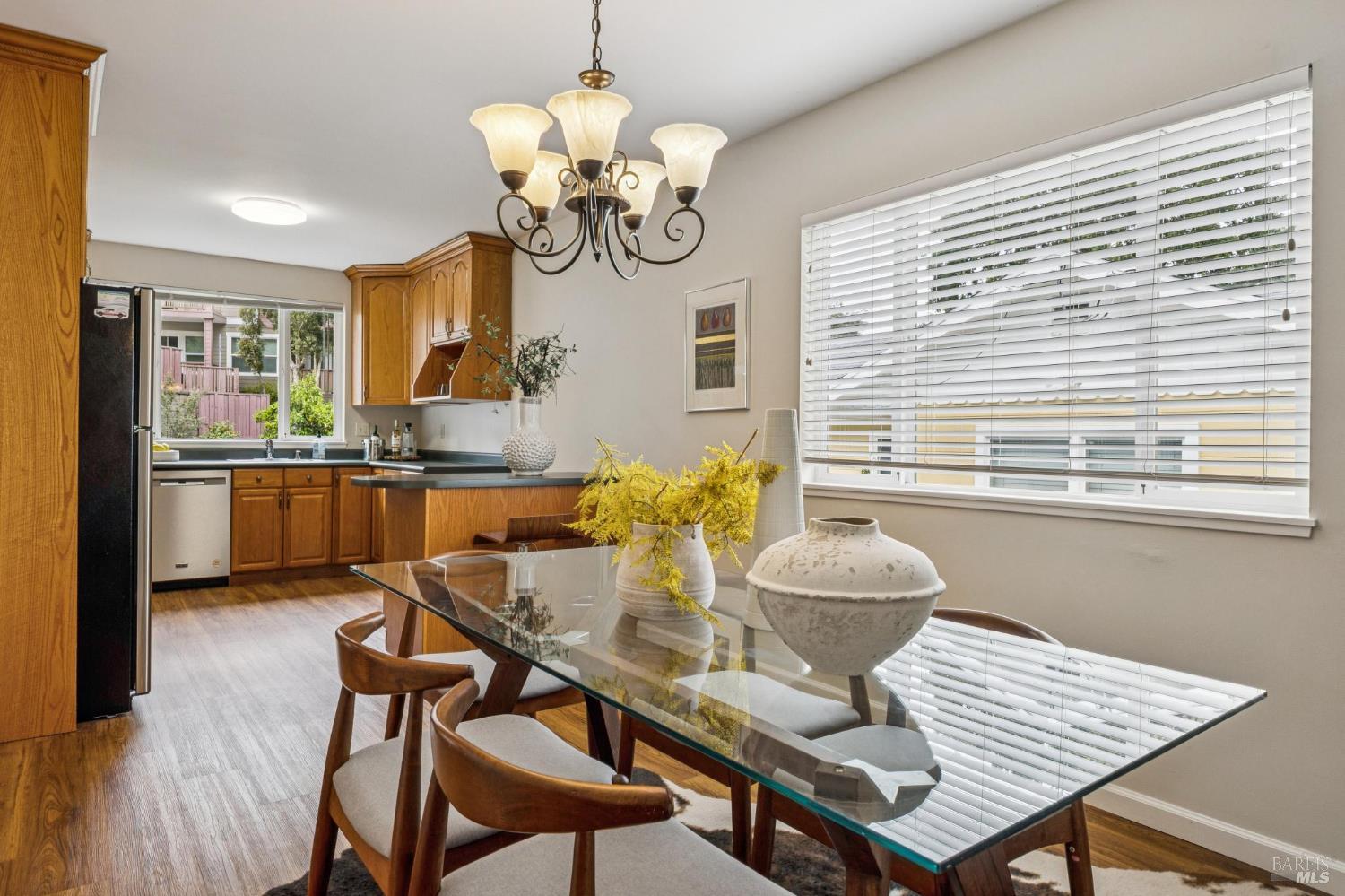 35 San Pablo Avenue San Rafael, CA 94903 - Photo 17 of 43 a dining room filled chandelier and wooden floor