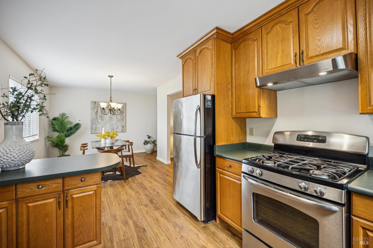 35 San Pablo Avenue San Rafael, CA 94903 - Photo 21 of 43 a kitchen with stainless steel appliances granite countertop a stove refrigerator and cabinets