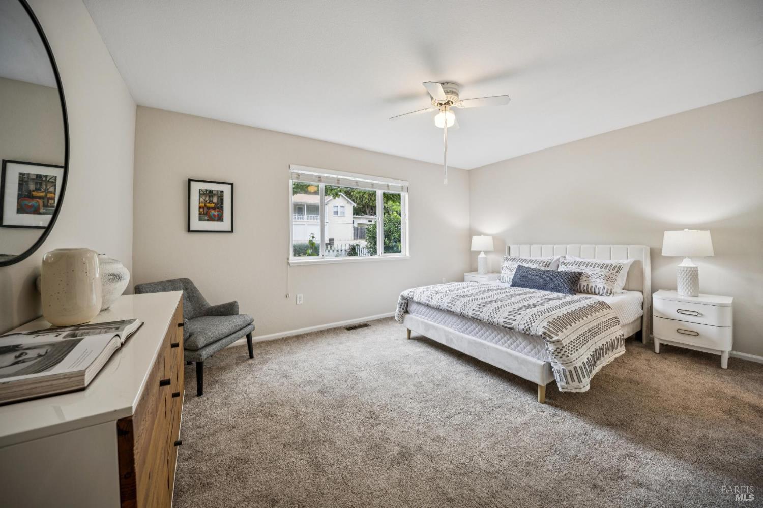 35 San Pablo Avenue San Rafael, CA 94903 - Photo 25 of 43 a spacious bedroom with a bed a table and chair
