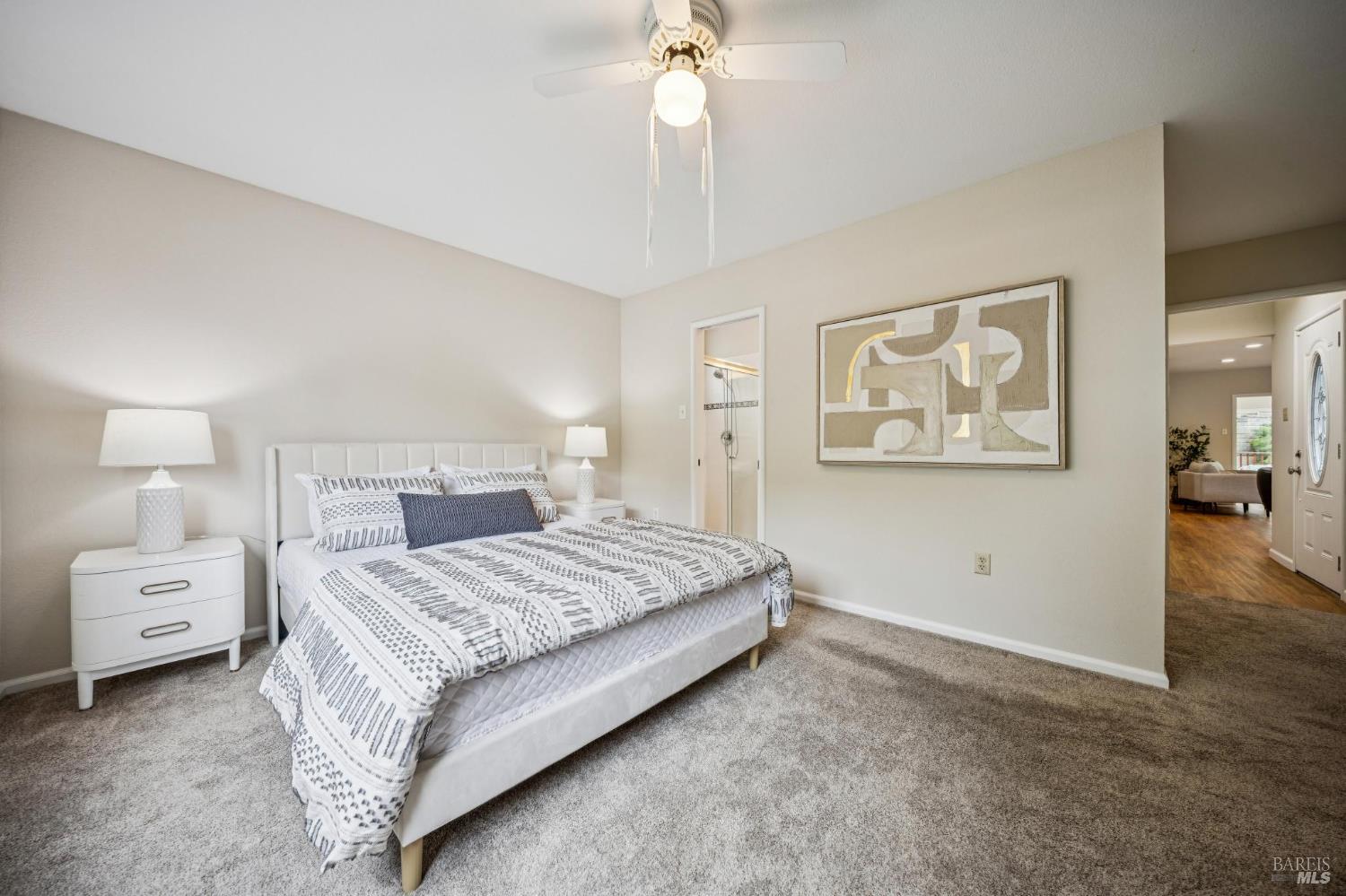 35 San Pablo Avenue San Rafael, CA 94903 - Photo 26 of 43 a bedroom with a bed and a chandelier