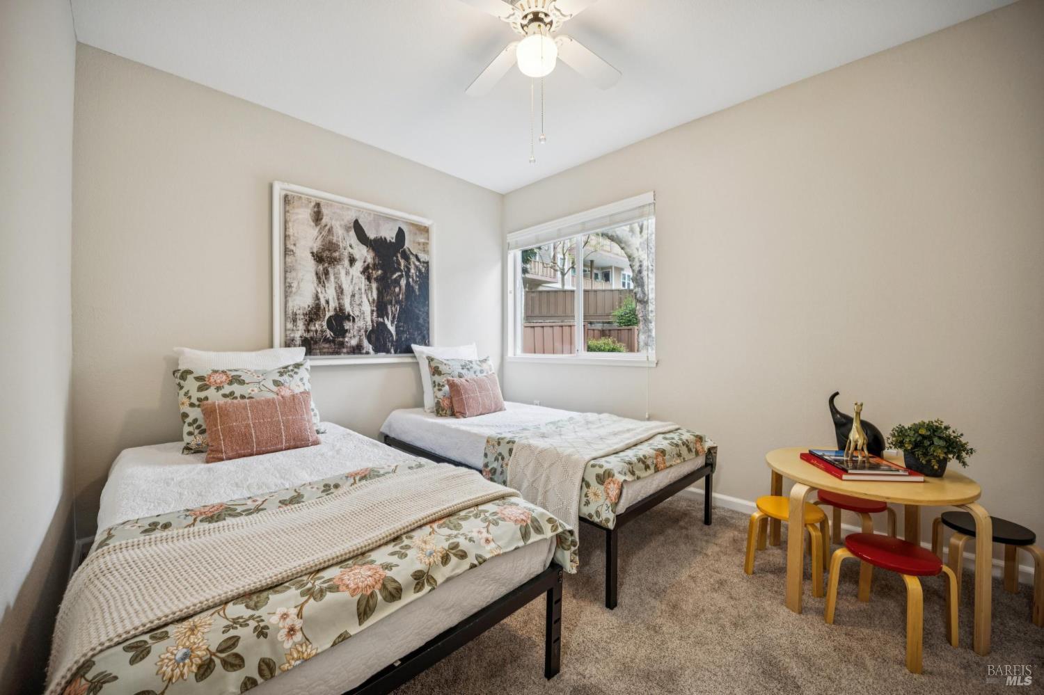 35 San Pablo Avenue San Rafael, CA 94903 - Photo 31 of 43 a bedroom with a bed and a table in it with window