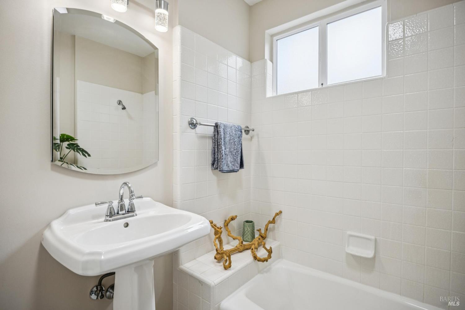 35 San Pablo Avenue San Rafael, CA 94903 - Photo 34 of 43 a bathroom with a sink a toilet and mirror