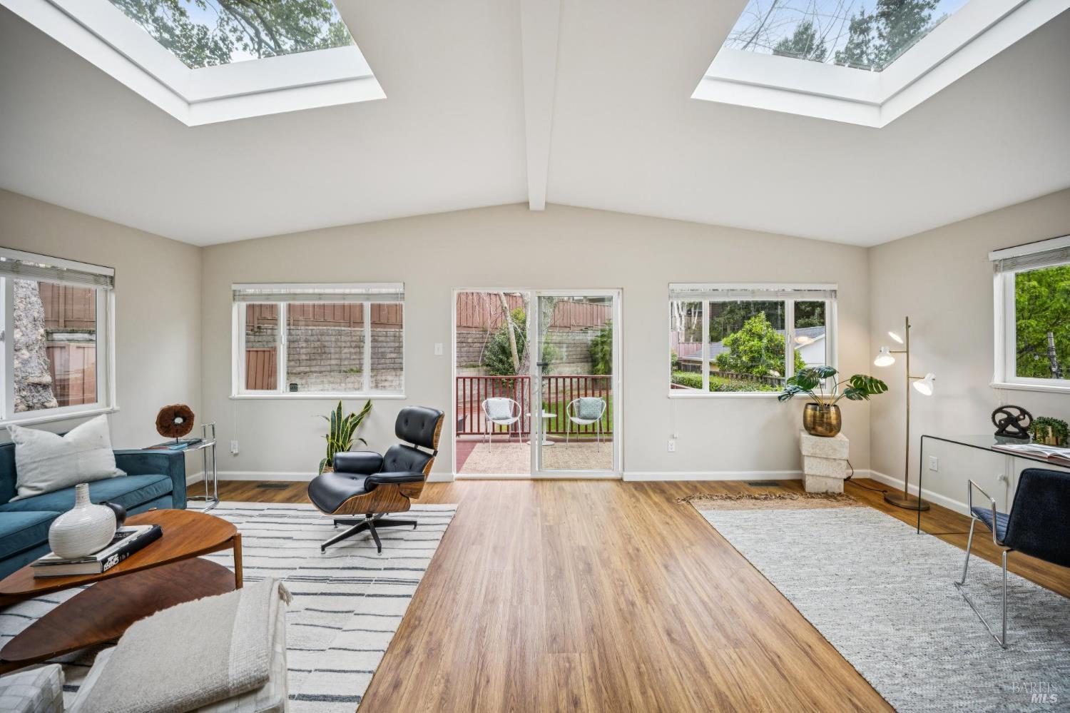 35 San Pablo Avenue San Rafael, CA 94903 - Photo 10 of 43 a living room with furniture and a wooden floor