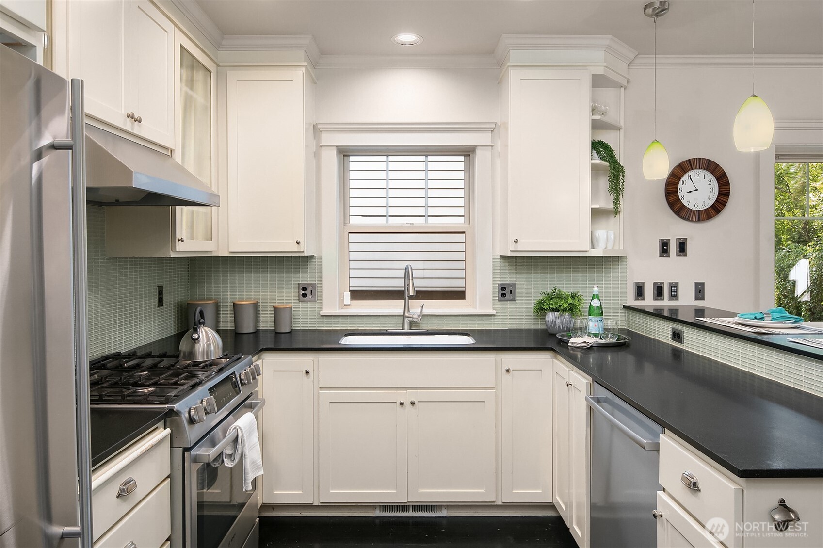 527 11th Avenue East, Unit A Seattle, WA 98102 - Photo 13 of 37 a kitchen with cabinets and window