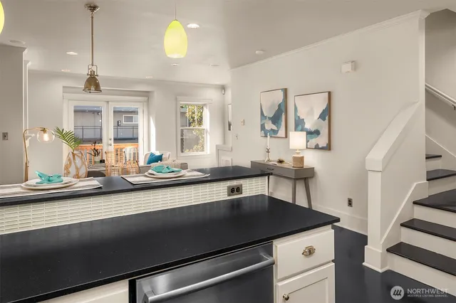 a kitchen with a sink cabinets and window