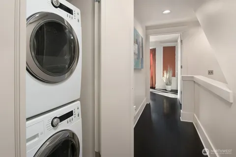 a view of a hallway with washer and dryer