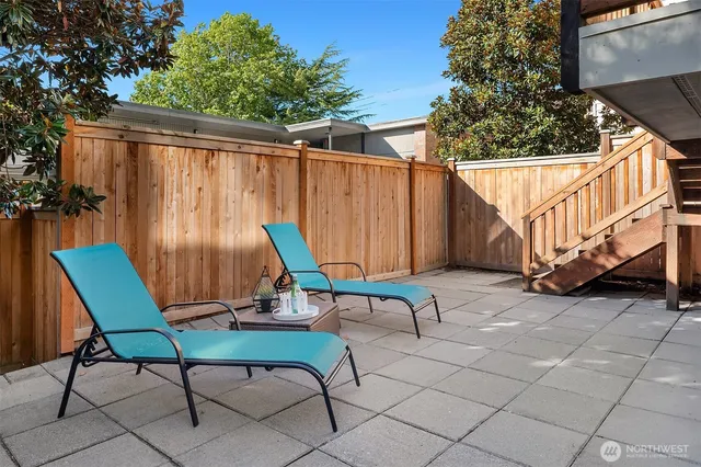 a view of backyard with a table and chairs