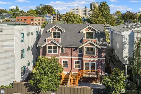 a aerial view of a house with a yard