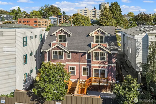 a aerial view of a house with a yard